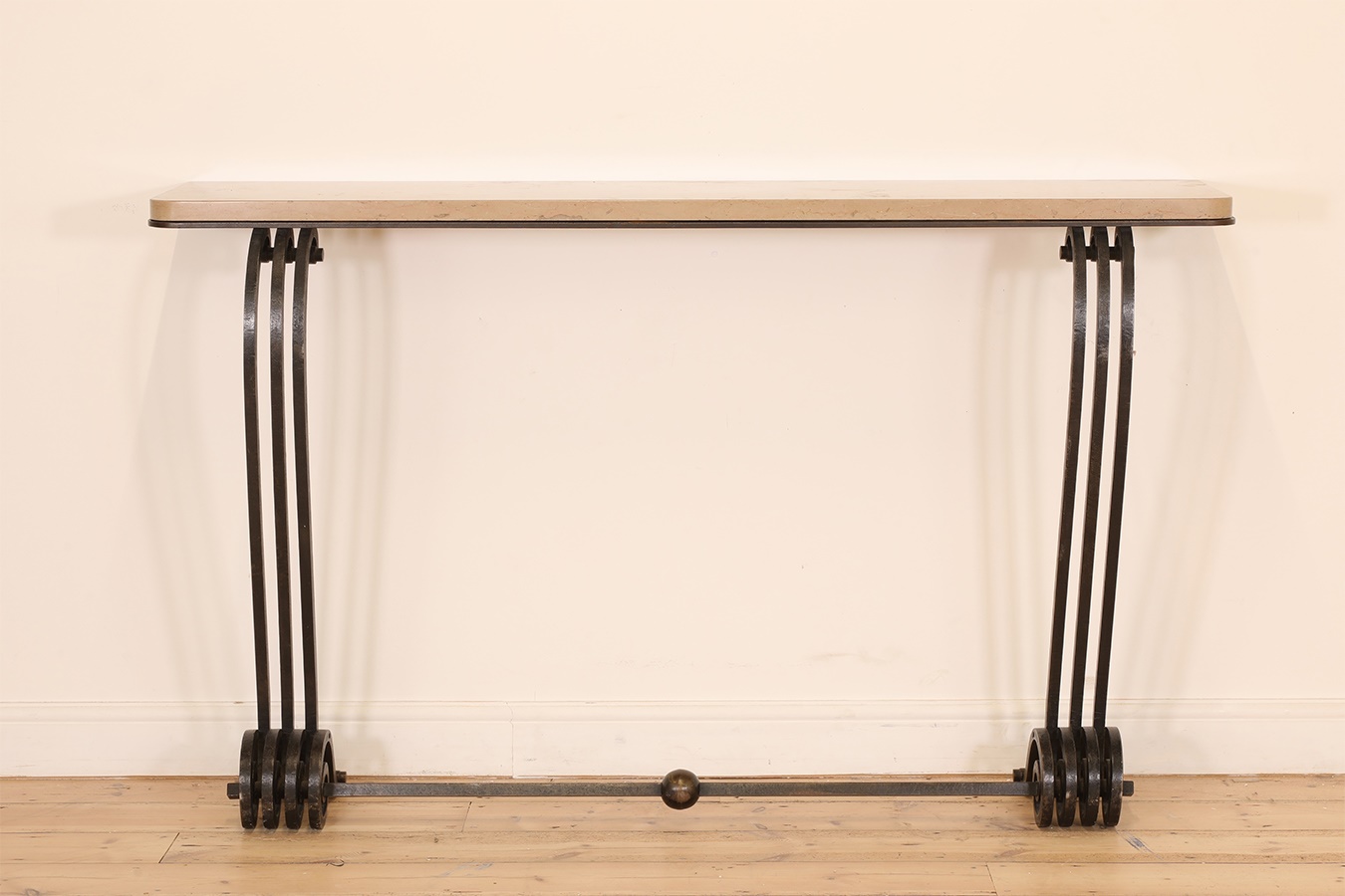 An Art Deco wrought iron and marble console table